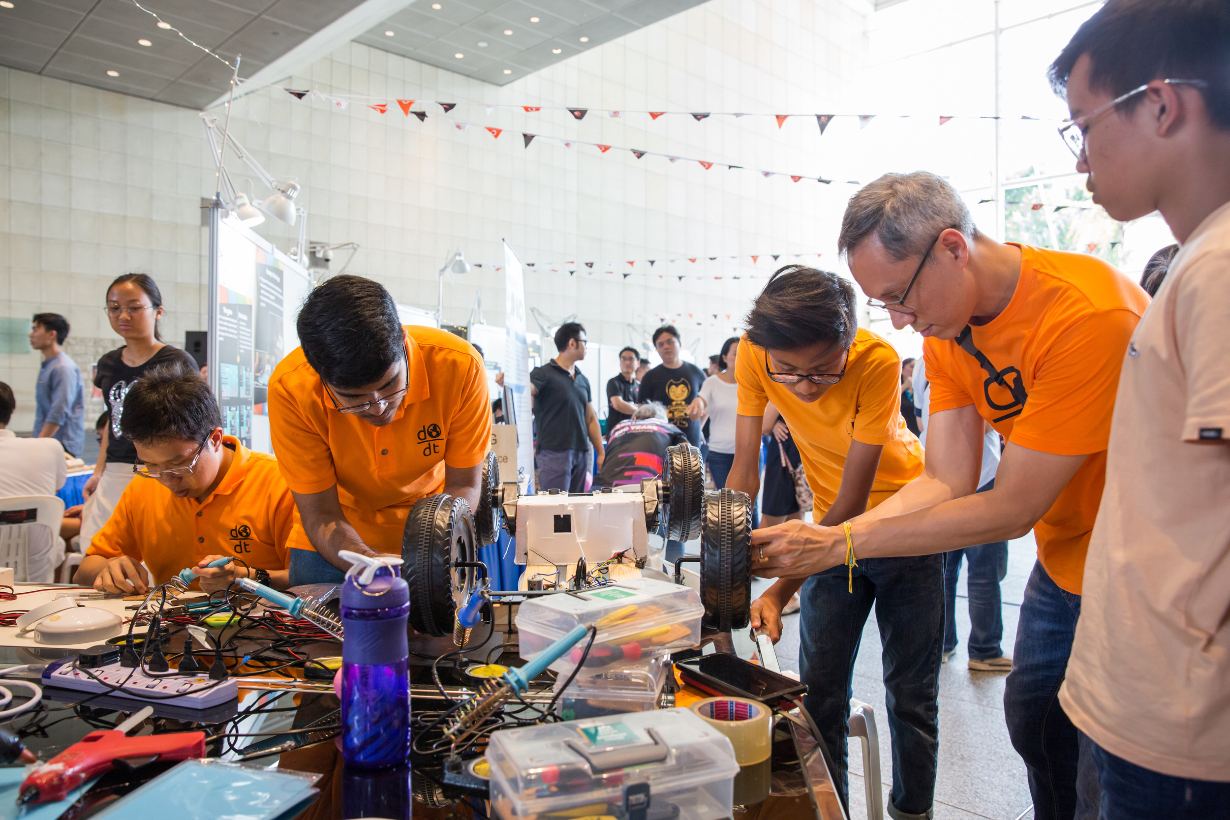 Volunteers at Tech For Good festival by Engineering Good, a charity in Singapore creating open-source assistive technology solutions for seniors and the disability community.